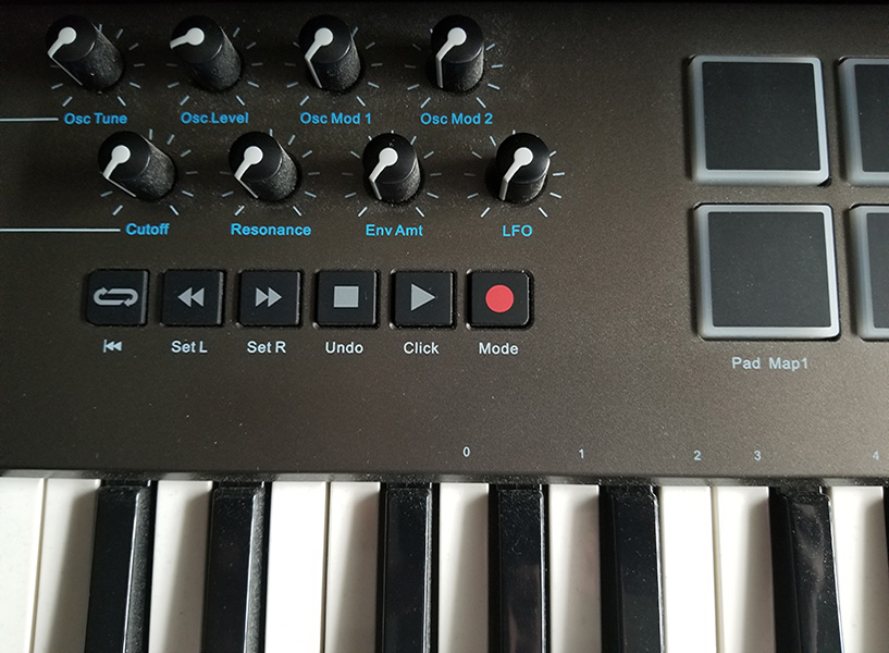 Photo of MIDI keyboard with knobs and pads